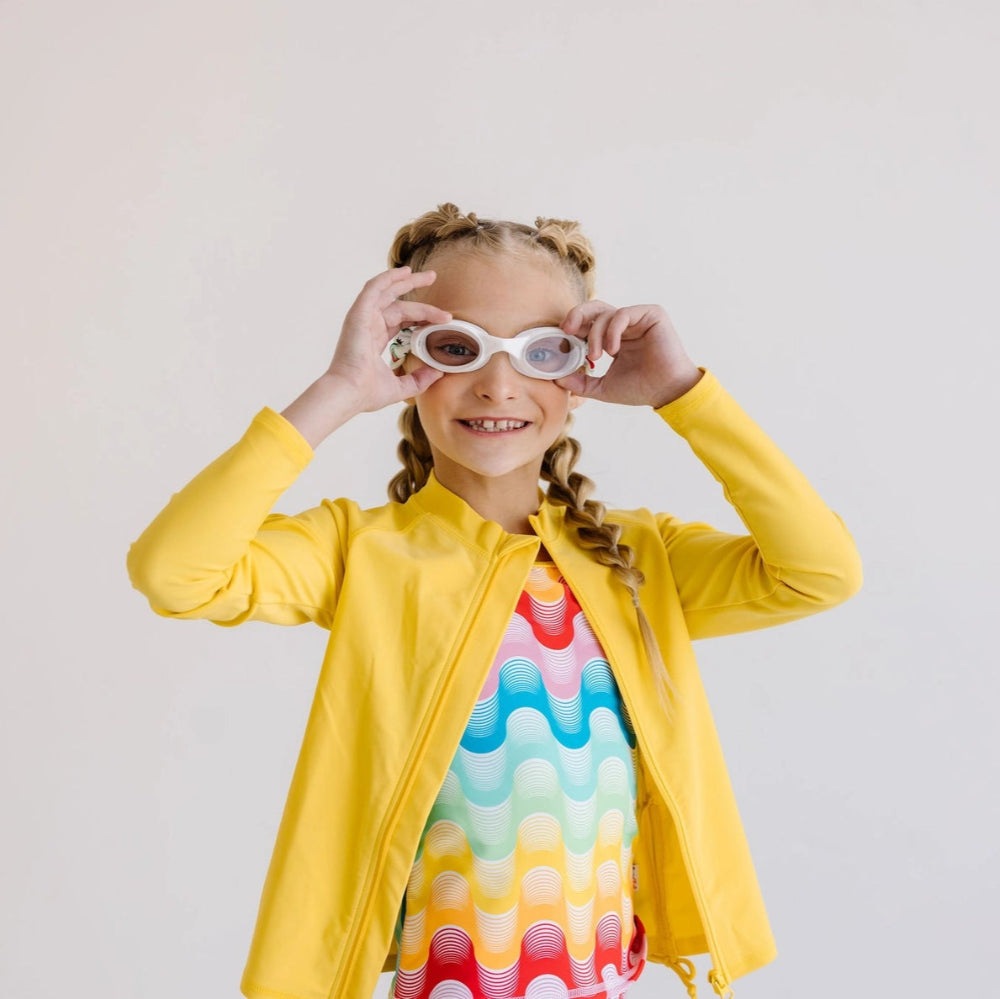 Splash Swim Goggles Strawberry Fields for kids, white goggles, rainbow swirl swimsuit, girl in yellow jacket