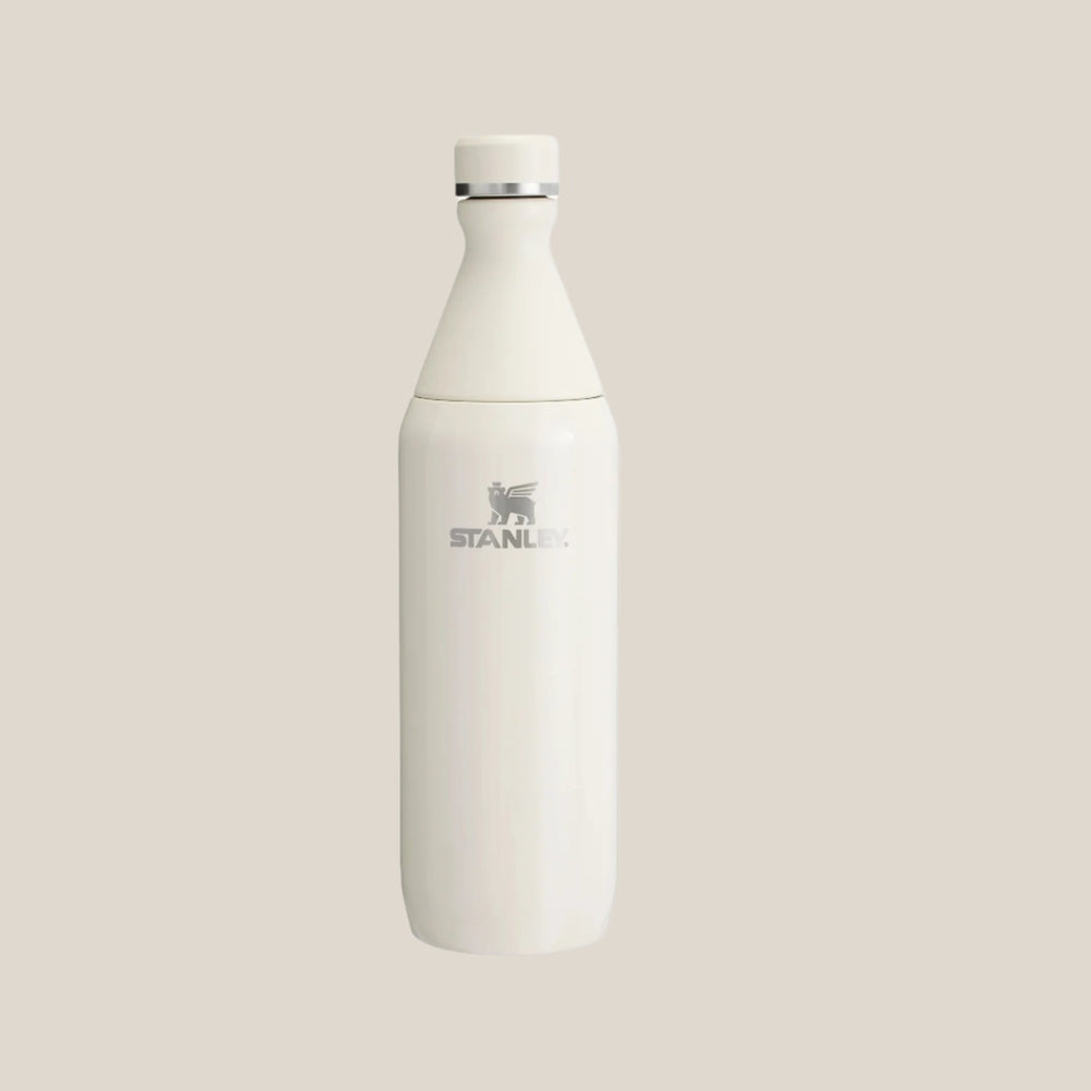 Stanley All Day Slim Bottle 20 oz, white stainless steel, standing upright with a secure screw-top lid.