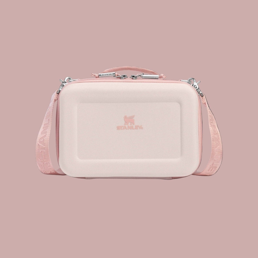 Stanley Allday Mini Lunchbox 4.2Qt/4.0L in soft pink, carried by its pink strap against a neutral backdrop.