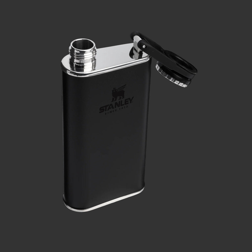 Stanley Classic Flask 8oz in black with chrome cap hinged open for on-the-go hydration.