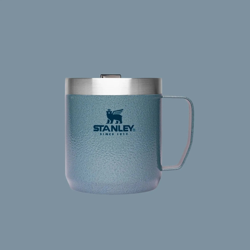 Stanley Classic Stay-Hot Camp Mug 12 oz in blue textured stainless steel with lid, perfect for on-the-go.