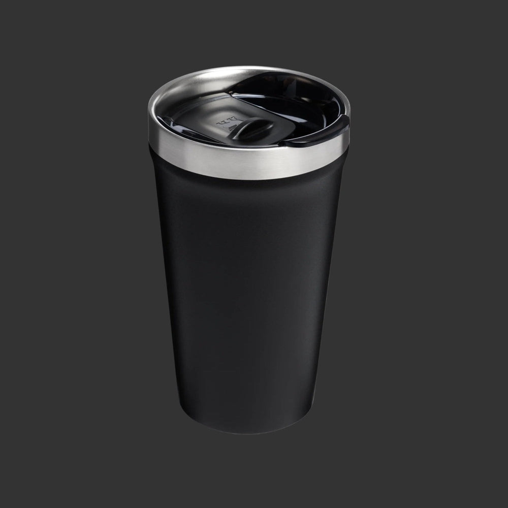 Stanley Everyday Tumbler 16oz in black with stainless steel rim, lid closed for spill-proof sipping.