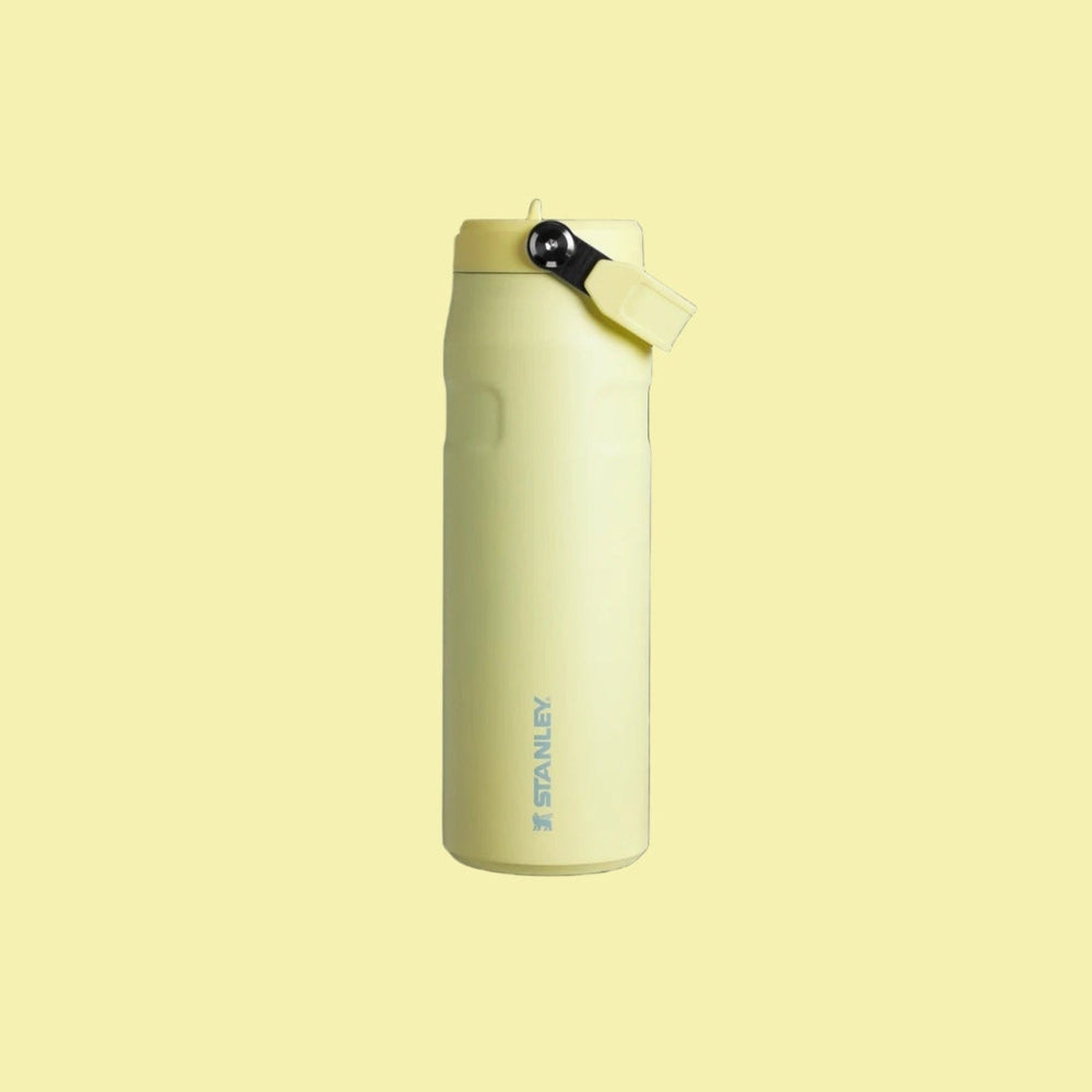 Stanley Iceflow Aerolight Flip Straw Vacuum Water Bottle 24oz in pale yellow, lid flipped open.