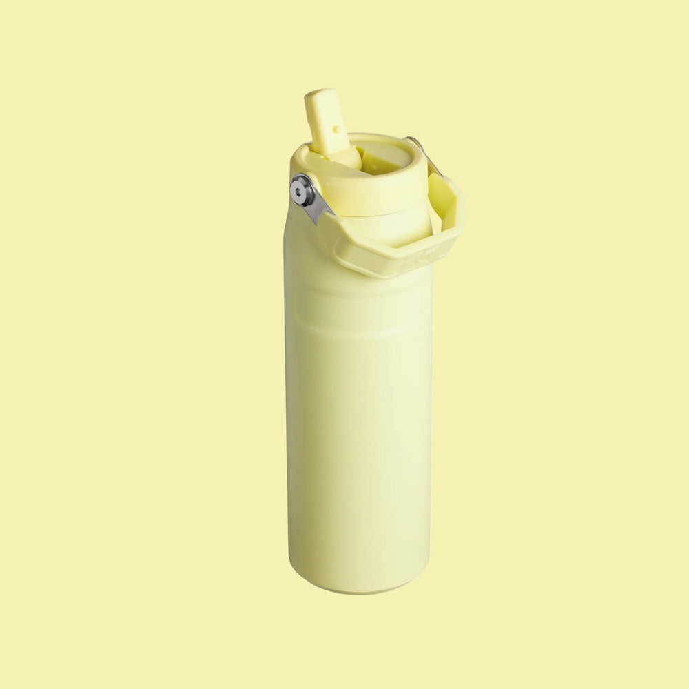Stanley Iceflow Aerolight Flip Straw Vacuum Water Bottle 24oz in pale yellow, with straw flipped up for easy sipping