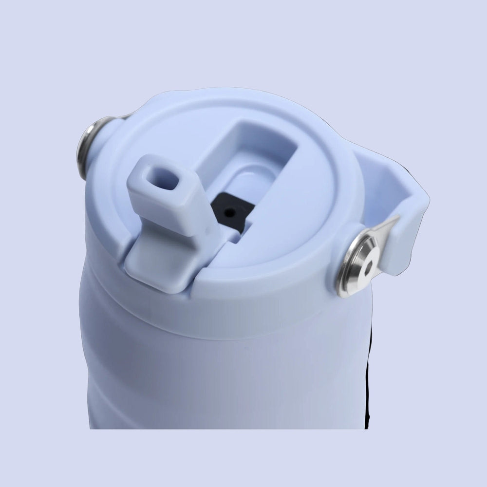 Stanley Iceflow Aerolight Flip Straw Vacuum Water Bottle 24oz in light blue with flip-straw nozzle and locking latch in view