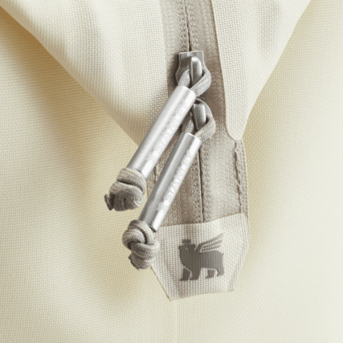 Stanley All Day Julienne Mini Cooler 7.4 Qt beige fabric cooler with gray zipper pulls and logo tag