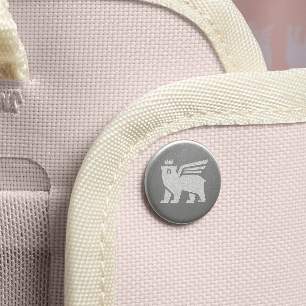 Stanley All Day Quencher Carry-All 30 oz bag in pale pink with cream handles and metal logo button