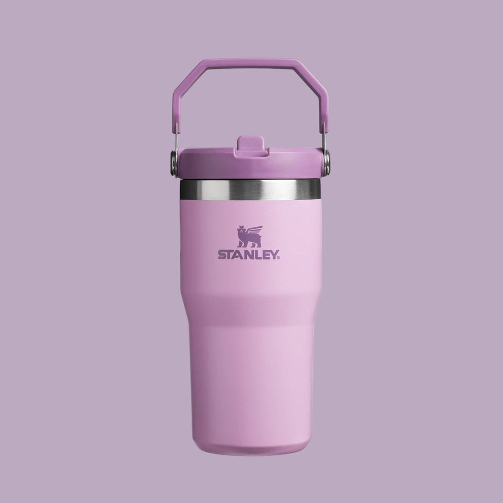 Stanley The Iceflow Flip Straw 2.0 Tumbler 20 oz in pink, featuring a purple lid and hinged handle with flip straw.