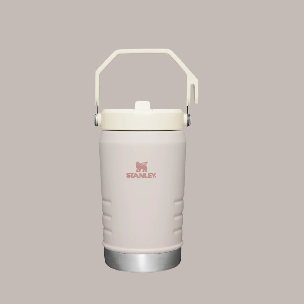 Stanley The Iceflow Flip Straw Jug 40 oz in pale pink, with a raised carry handle and secure lid