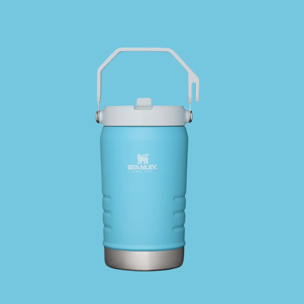 Stanley The Iceflow Flip Straw Jug 40 oz in blue with white lid and lifted carry handle