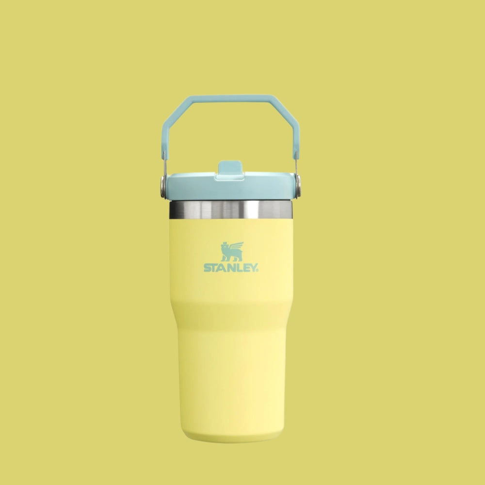 Stanley The Iceflow Flip Straw Tumbler 20 oz yellow with light blue lid and handle; STANLEY logo visible
