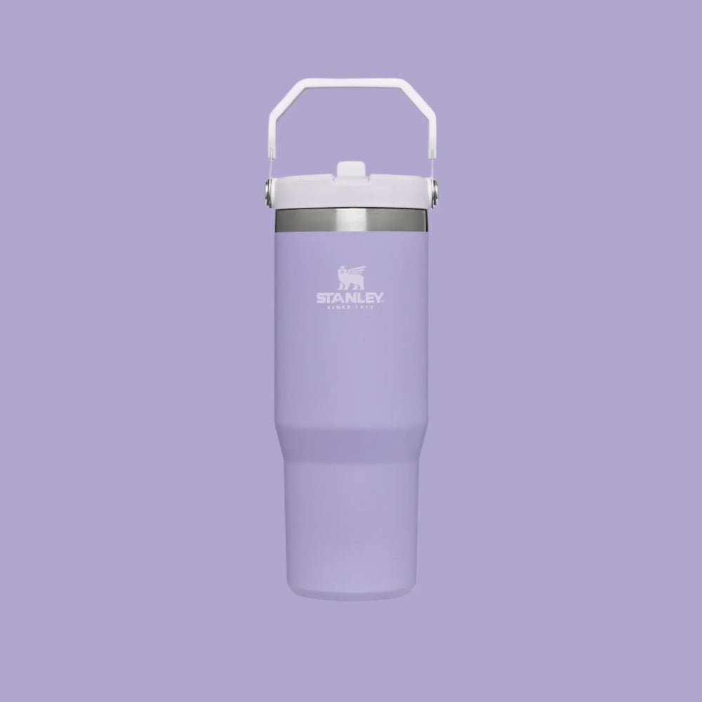 Stanley The Iceflow Flip Straw Tumbler 30 oz in lavender, white lid, attached handle for easy carrying.