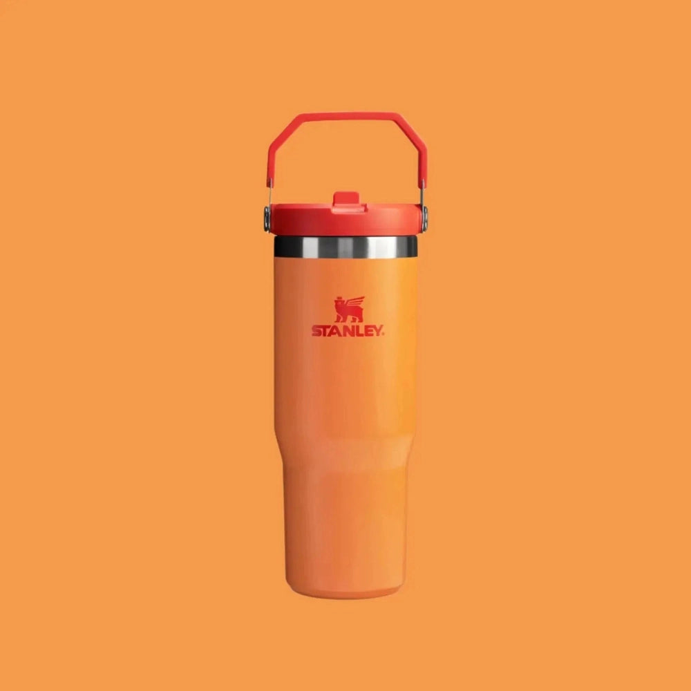 Stanley The Iceflow Flip Straw Tumbler 30 oz in orange with red flip lid and carry handle.