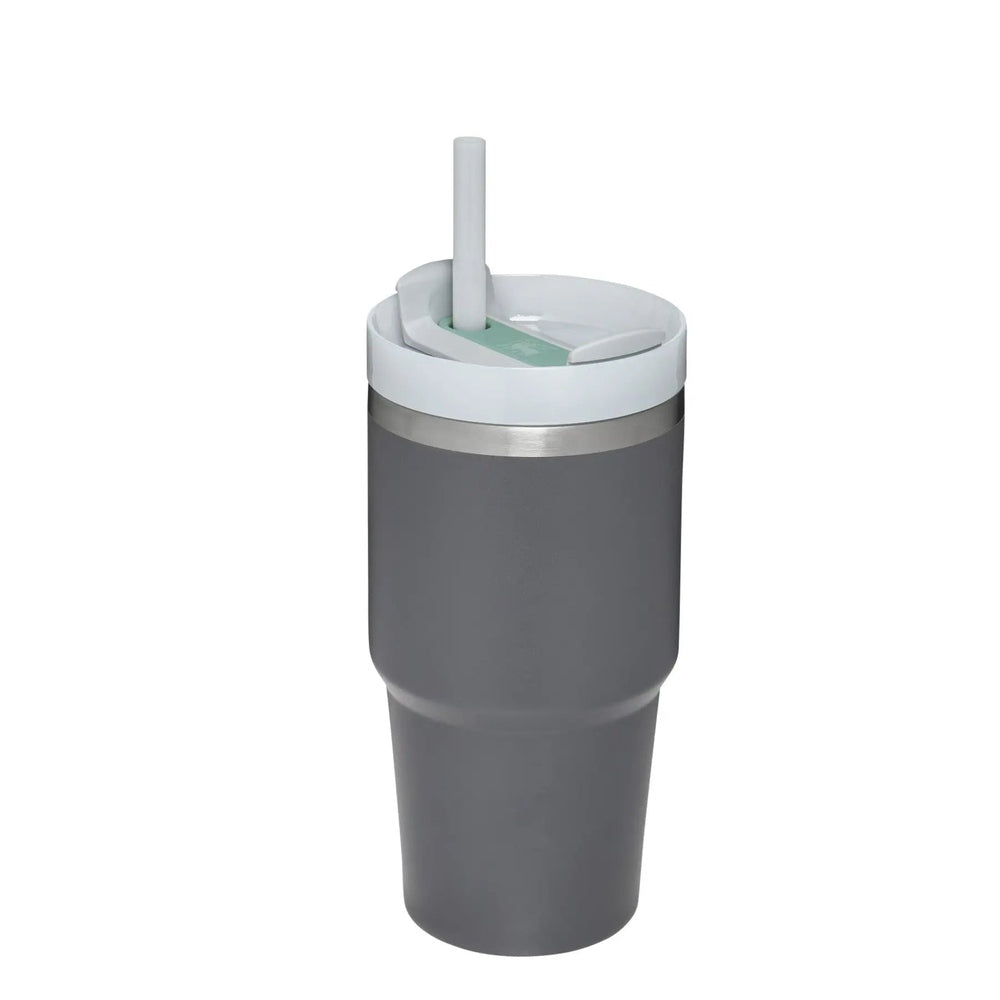Stanley The Quencher H2.0 Flowstate 20 oz tumbler, gray with white lid and straw, lid open for sipping.