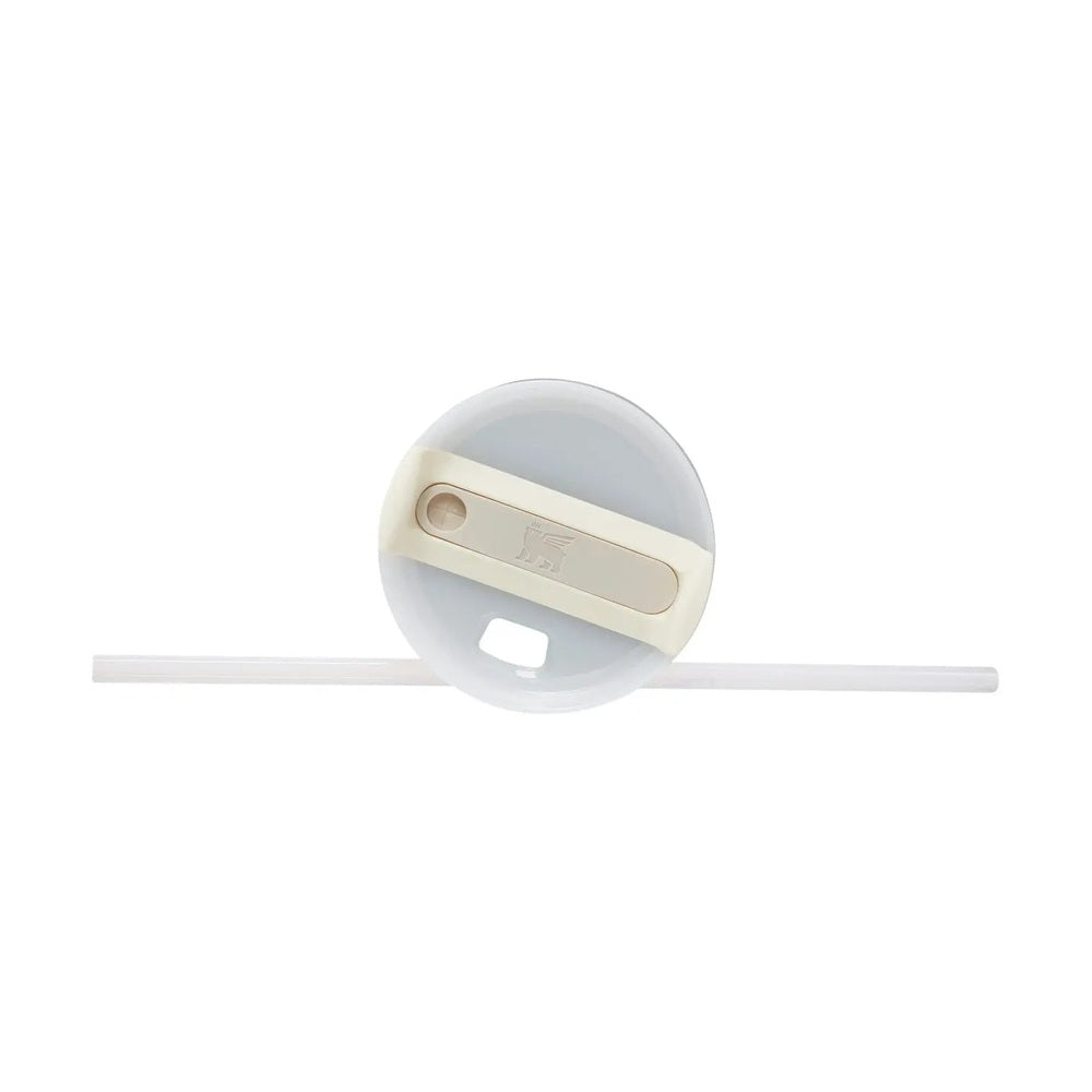 Stanley The Quencher H2.0 FlowState Tumbler 20 oz, cream lid with sliding tab and straw attached.