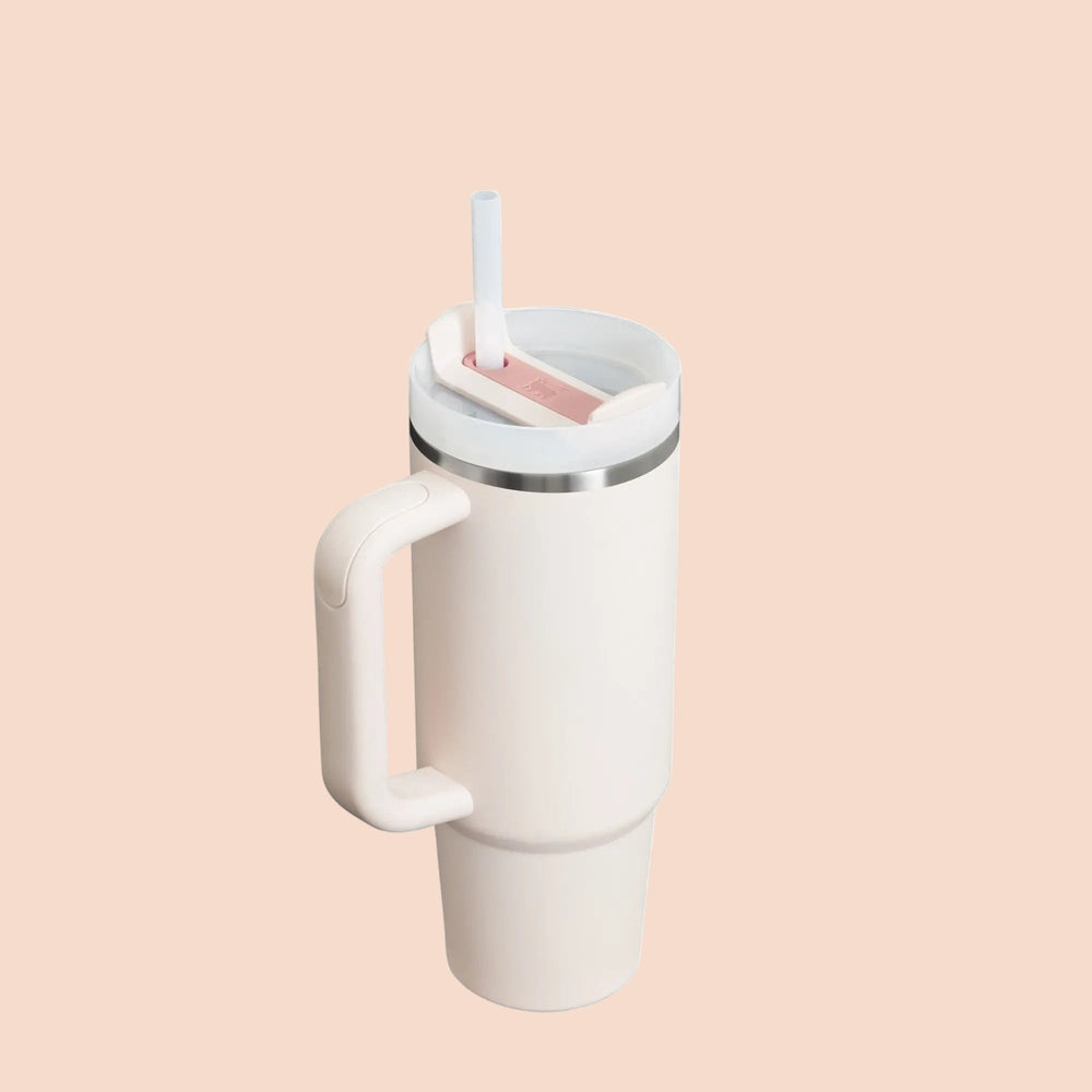 Stanley The Quencher H2.0 Flowstate 30 oz tumbler, white with pink insert, straw lid in use