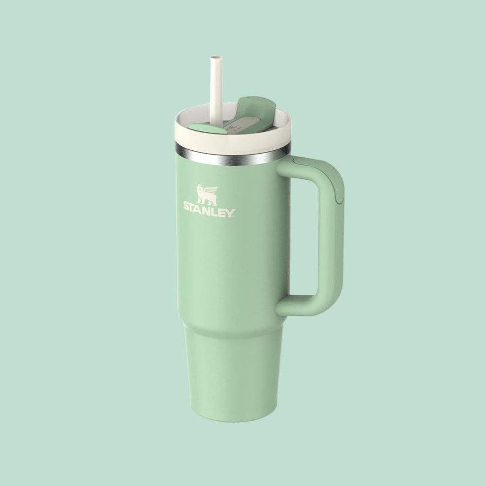 Stanley The Quencher H2.0 Flowstate Tumbler 30 oz in mint green with straw lid and handle ready to sip