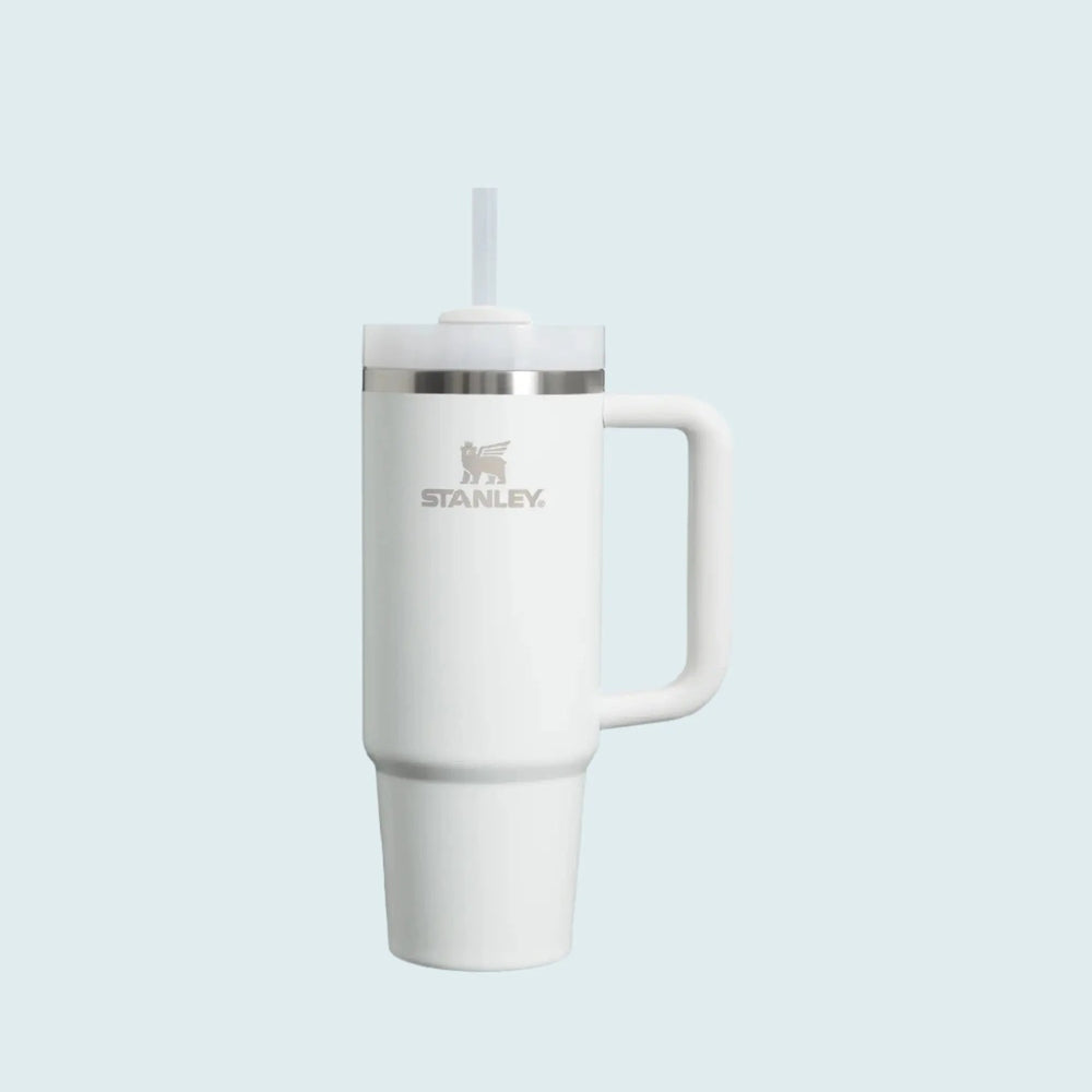 Stanley The Quencher H2.0 Flowstate Tumbler 30 oz in white with built-in straw in lid and side handle.