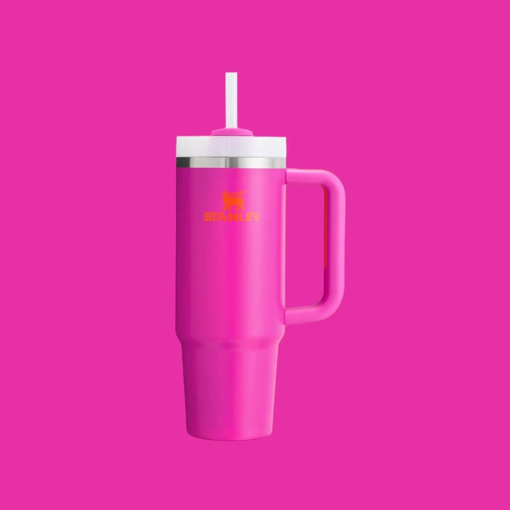 Stanley The Quencher H2.0 Flowstate Tumbler 30 oz in pink with white lid, straw attached for easy sipping.
