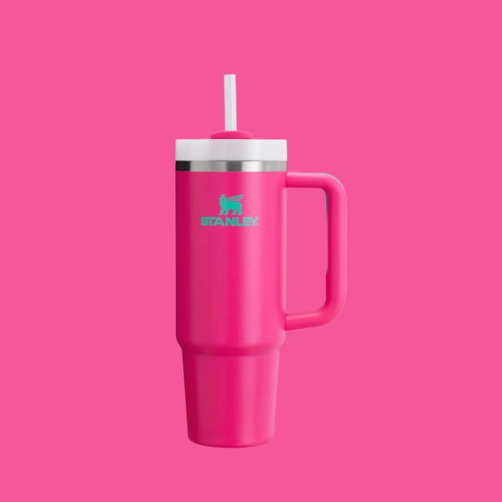 Stanley The Quencher H2.0 Flowstate Tumbler 30 oz in pink with teal logo, white lid, built-in straw for easy sipping