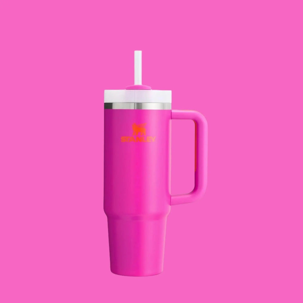 Stanley The Quencher H2.0 Flowstate Tumbler 40 oz pink with white lid and straw, showing its pink handle.