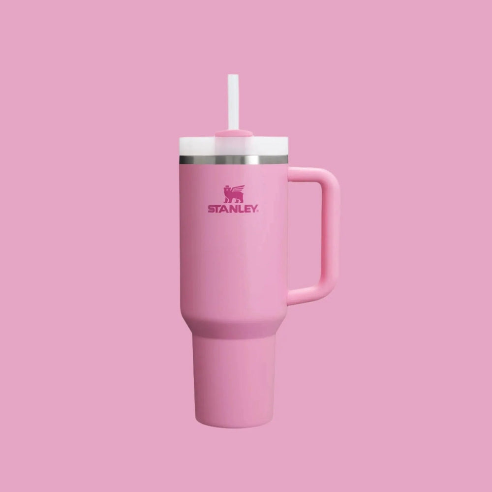 Stanley The Quencher H2.0 Flowstate Tumbler 40 oz in pink with pink lid, white straw, handle shown.
