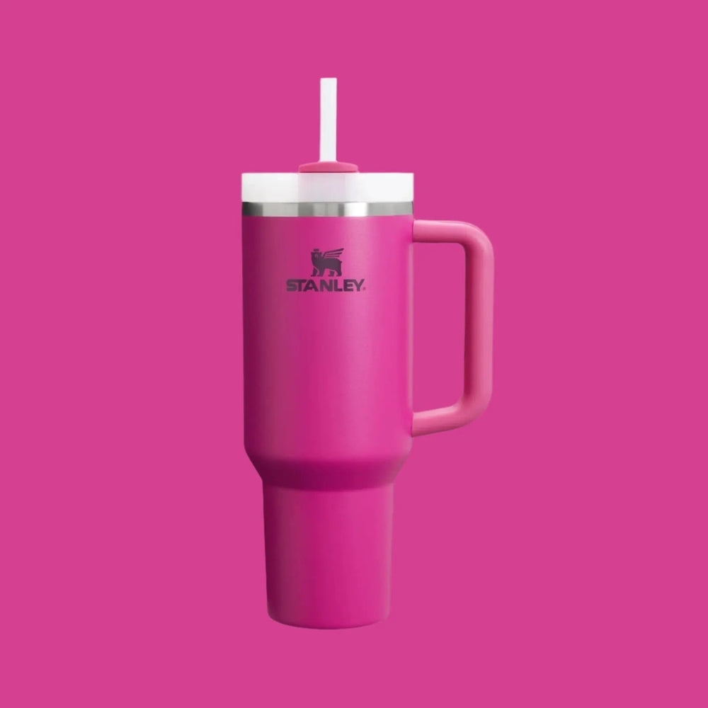 Stanley The Quencher H2.0 Flowstate Tumbler 40 oz in pink with white lid and straw, ready for on-the-go sipping.