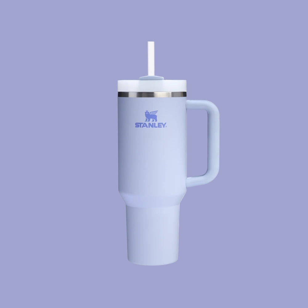 Stanley The Quencher H2.0 Flowstate Tumbler 40 oz in light blue, straw inserted and ready to sip.