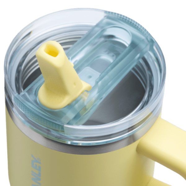 Stanley The Quencher Protour Flip Straw Tumbler 20 oz yellow with clear lid, flipped straw ready to sip.
