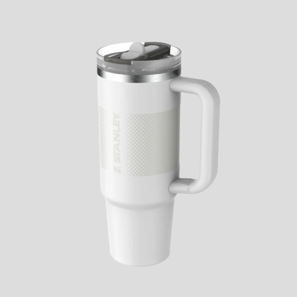 Stanley The Quencher Protour Flip Straw Tumbler 30 oz in white stainless steel, with handle and flip straw lid in use