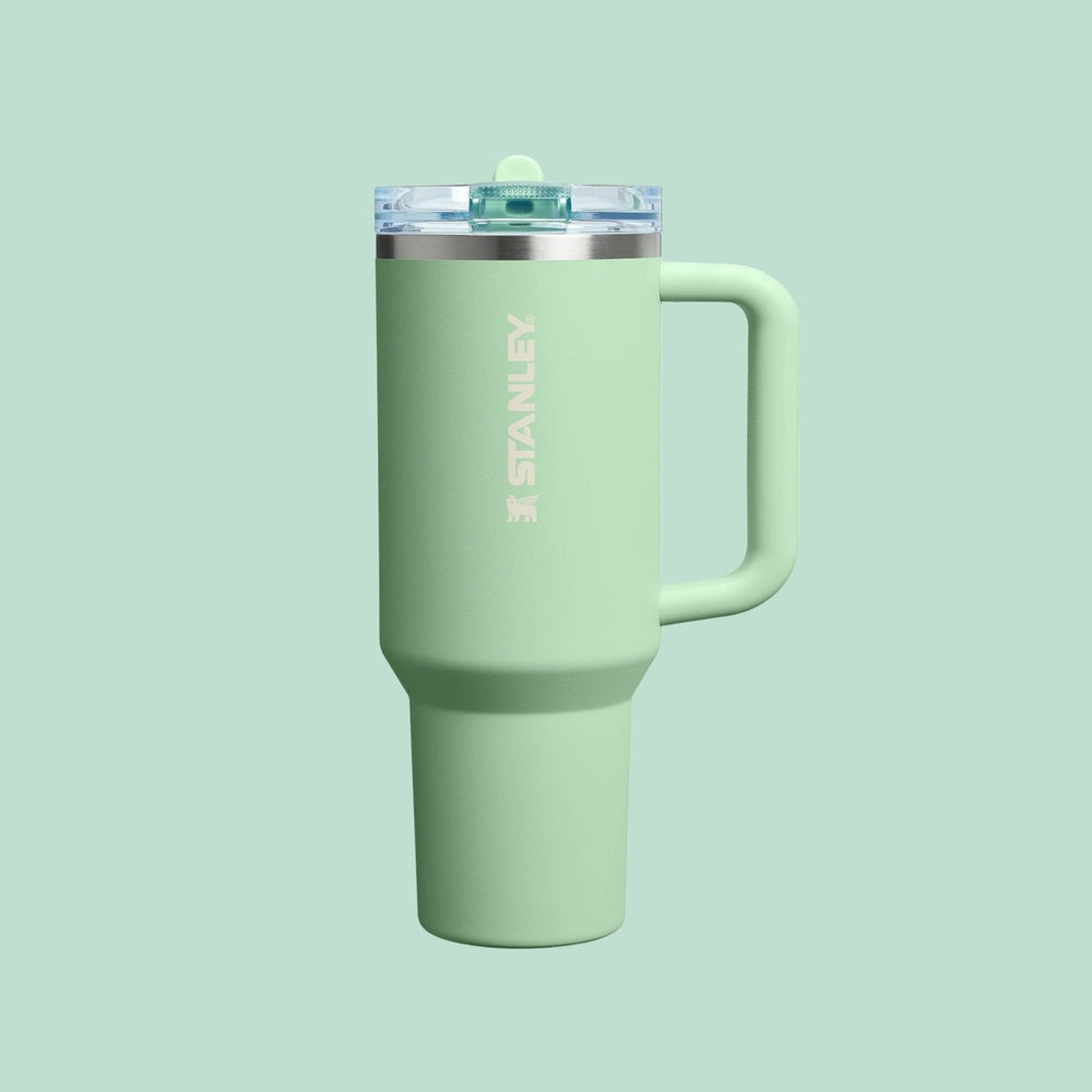 Stanley The Quencher Protour Flip Straw Tumbler 40 oz mint green with handle and flip-top lid.