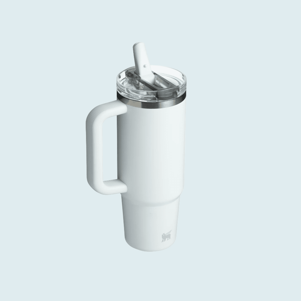 Stanley The Quencher ProTour Flip Straw Tumbler 30 oz in white with built-in handle; lid open, straw ready.