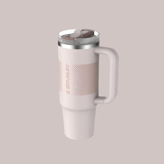 Stanley The Quencher ProTour Flip Straw Tumbler 30 oz in pale pink with stainless lid, showing a flip-top straw.