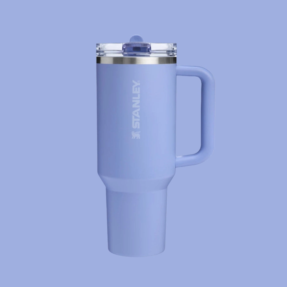 Stanley The Quencher Protour Flip Straw Tumbler 30 oz lavender with clear lid and side handle.