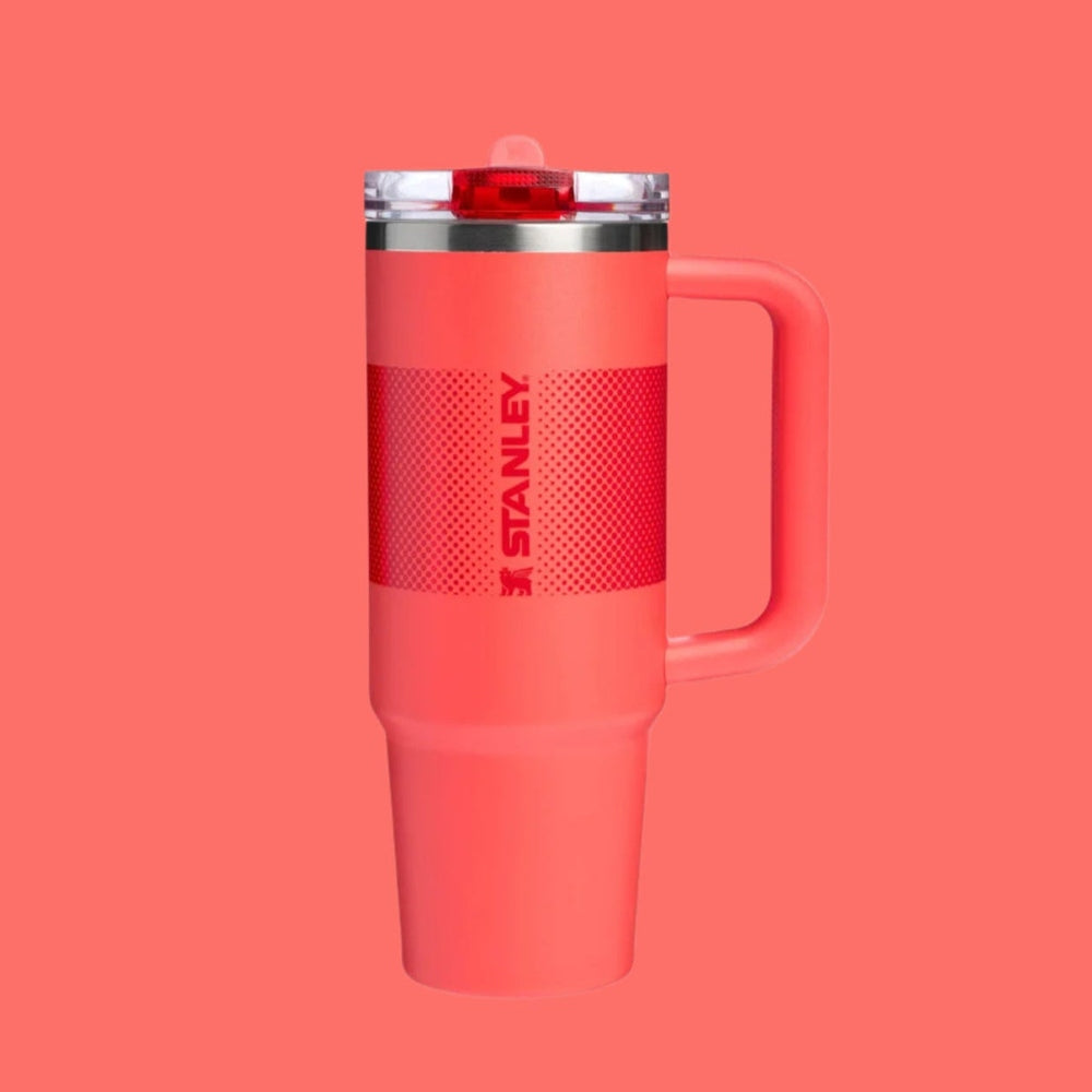 Stanley The Quencher Protour Flip Straw Tumbler 30 oz in coral pink with a side handle and flip-top lid for easy sipping