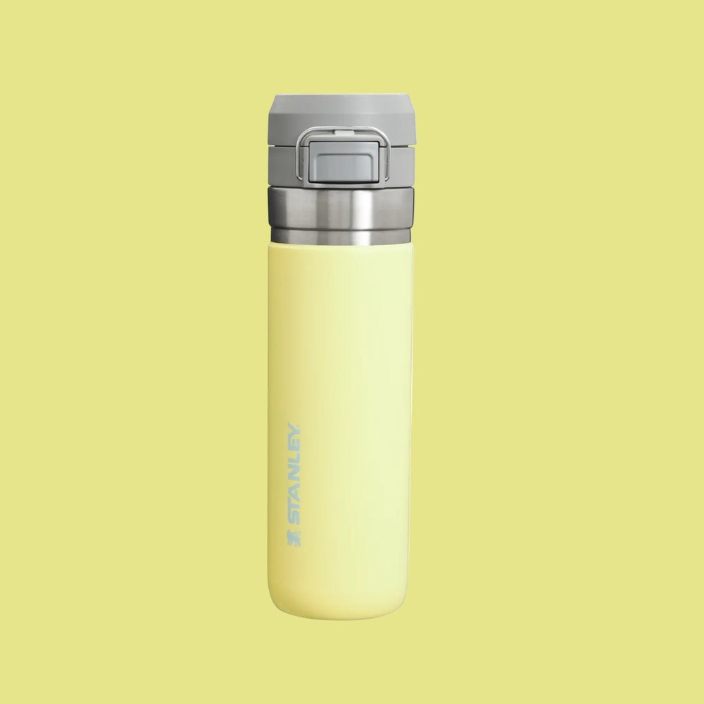 Stanley The Quick Flip GO Bottle 24 oz in yellow with gray flip-top lid showing STANLEY branding.