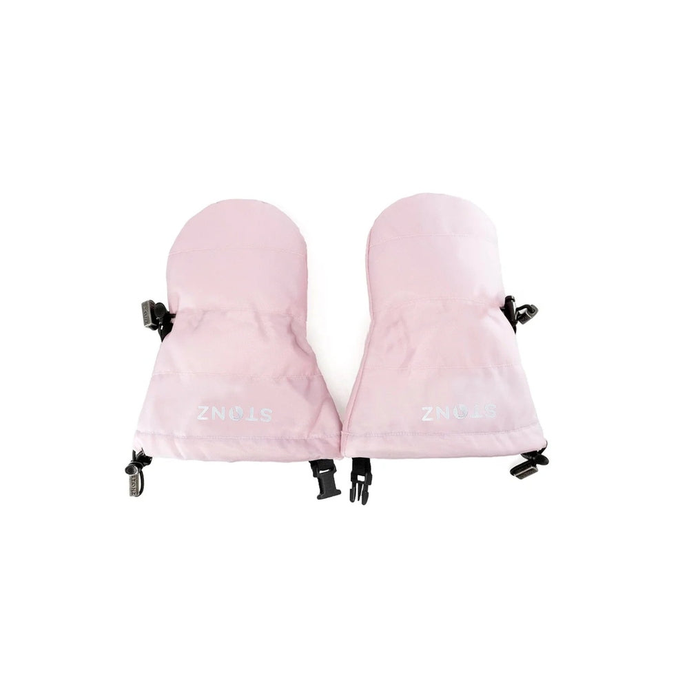 Stonz Baby Mitts Haze Pink—pale pink toddler mittens with clips shown attached to a coat sleeve.