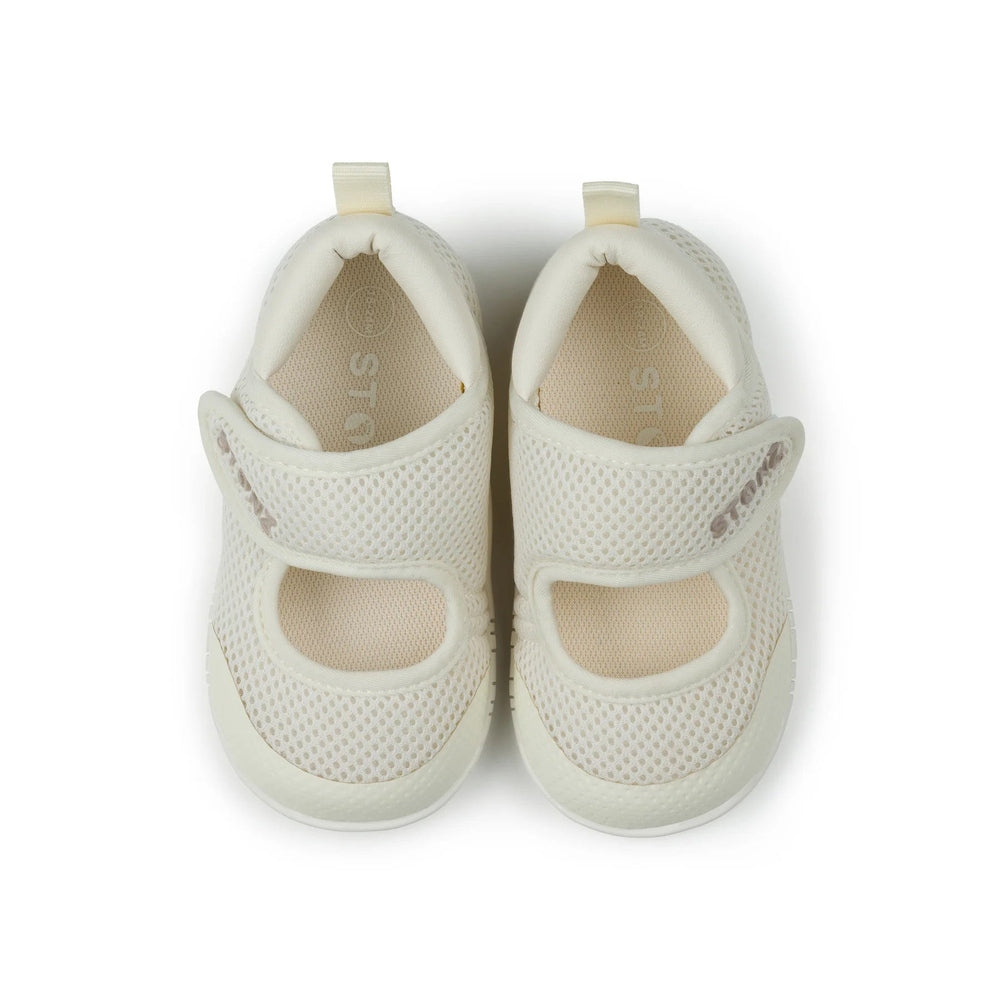 Stonz Cruiser Mary Jane Baby Shoes Ivory pair, top-down view shows white mesh uppers and adjustable Velcro straps