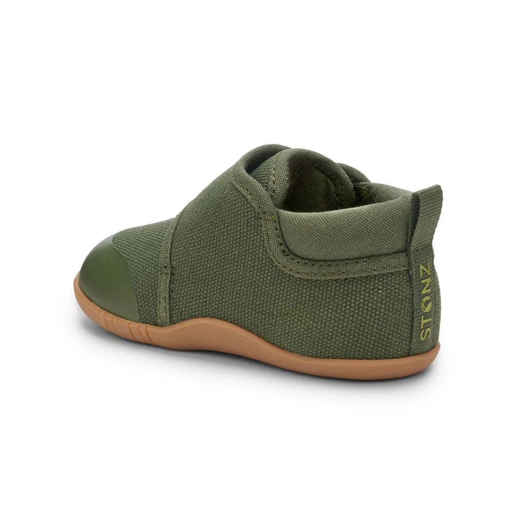 Stonz Cruiser Natural Baby Shoes Cypress in olive canvas with Velcro strap and tan sole, side view.