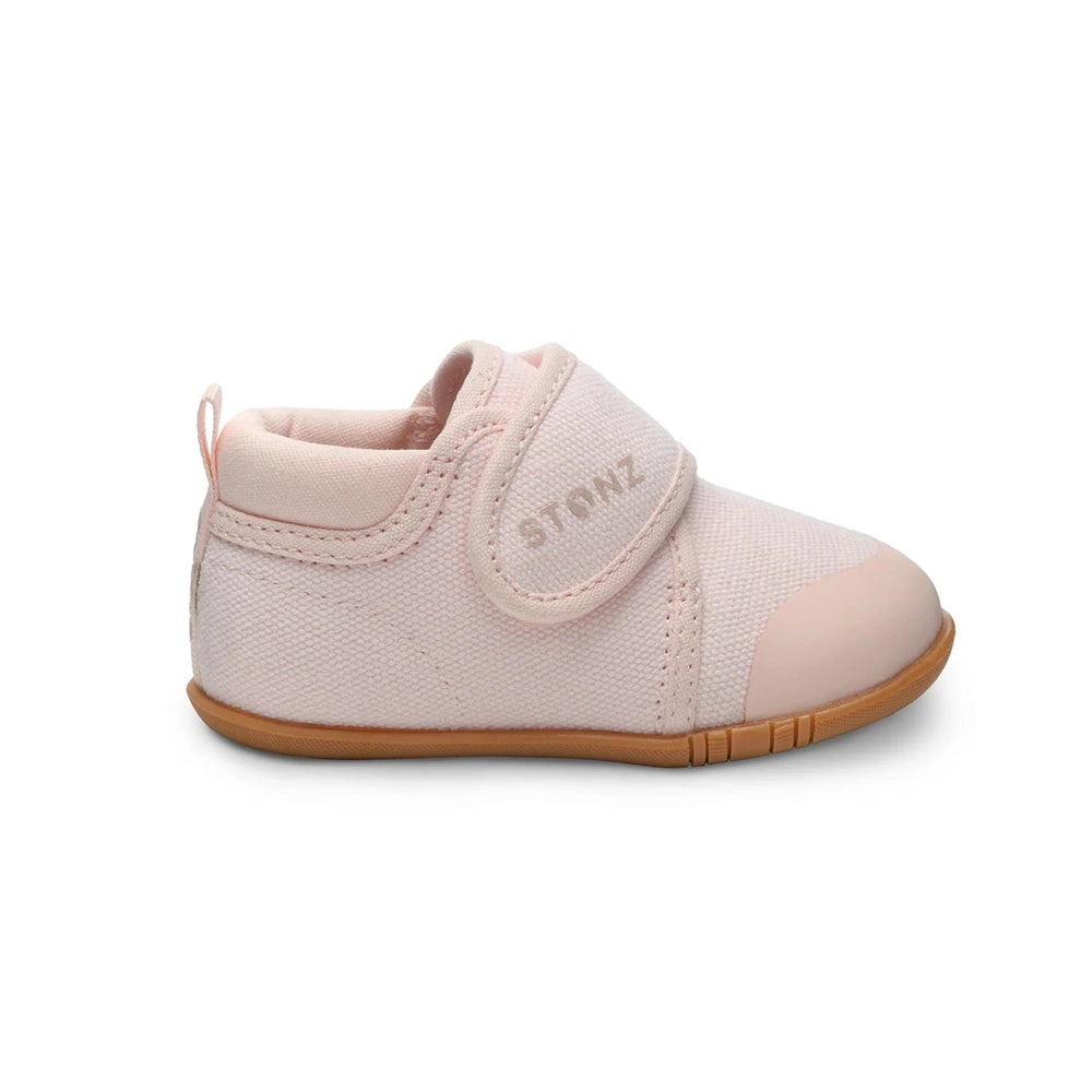 Stonz Cruiser Natural Baby Shoes Haze Pink, soft pink fabric with Velcro strap securing snug fit.