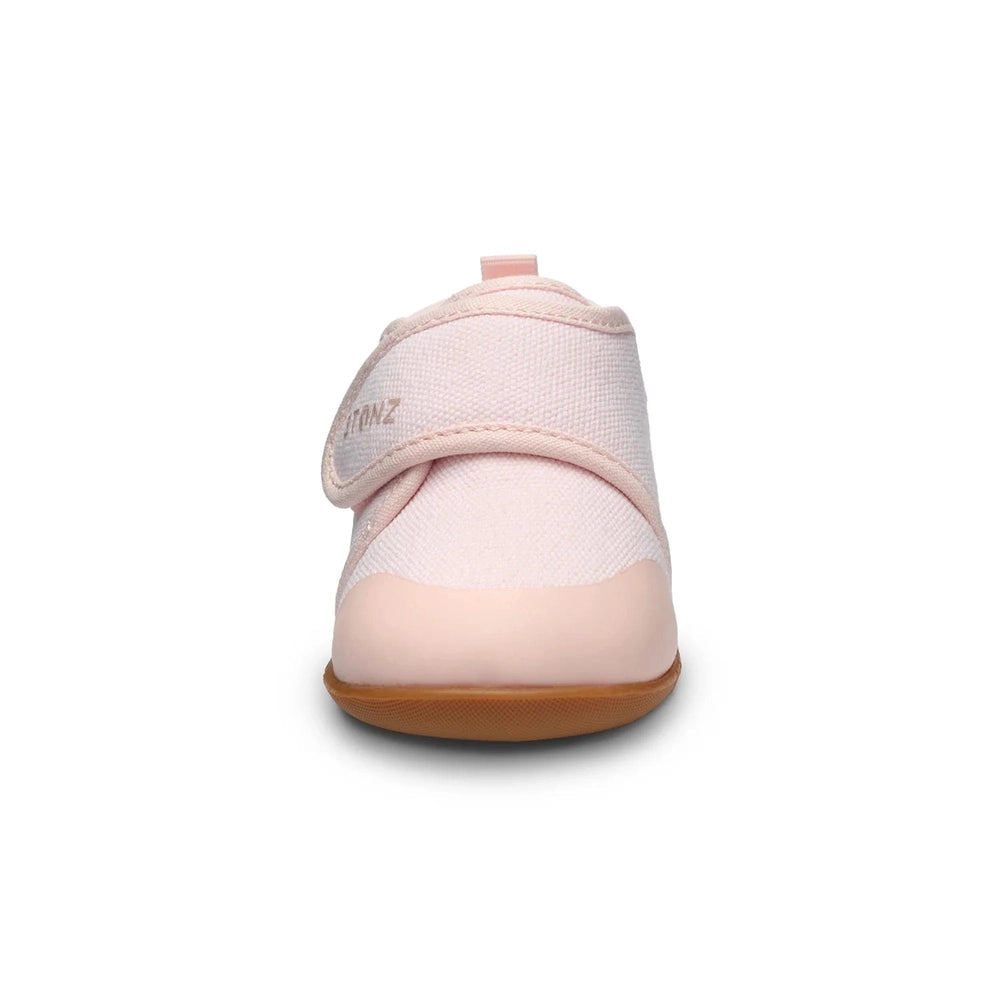 Stonz Cruiser Natural Baby Shoes Haze Pink with a pink Velcro strap securing the soft fabric upper.