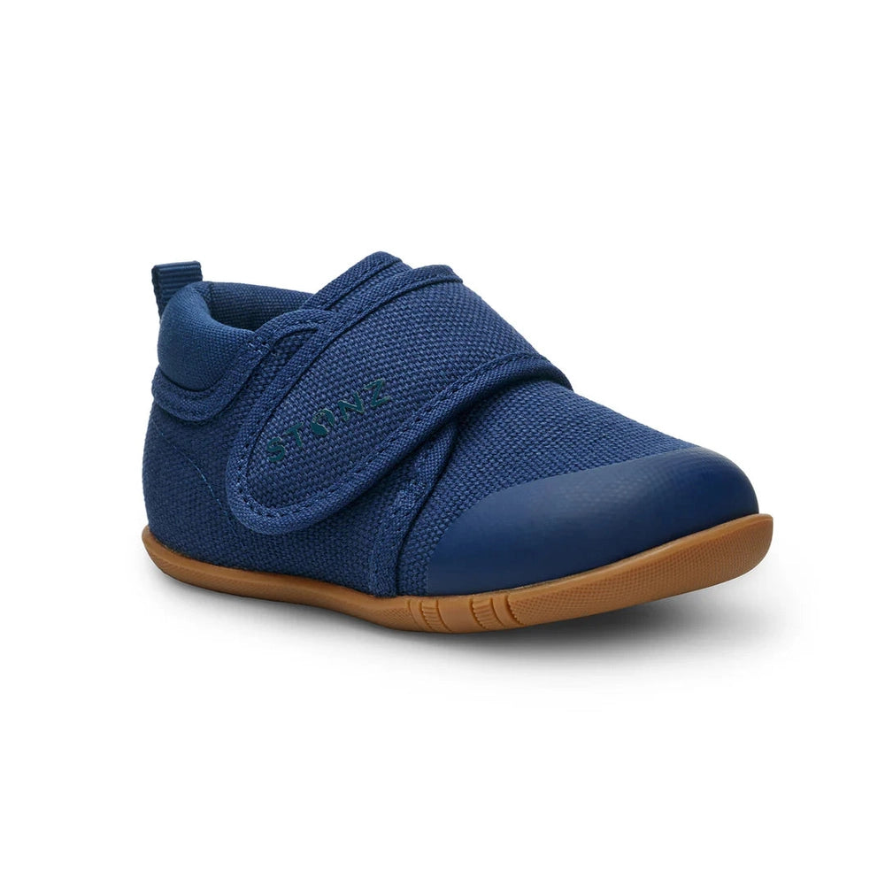 Stonz Cruiser Natural Baby Shoes Navy with Velcro strap fastened over navy fabric and tan sole.
