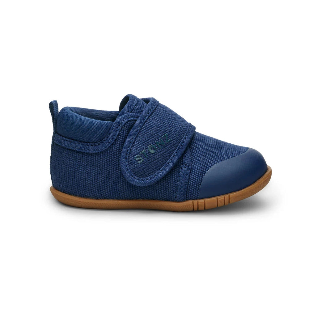 Stonz Cruiser Natural Baby Shoes Navy with Velcro straps fastened over navy knit upper and tan sole.