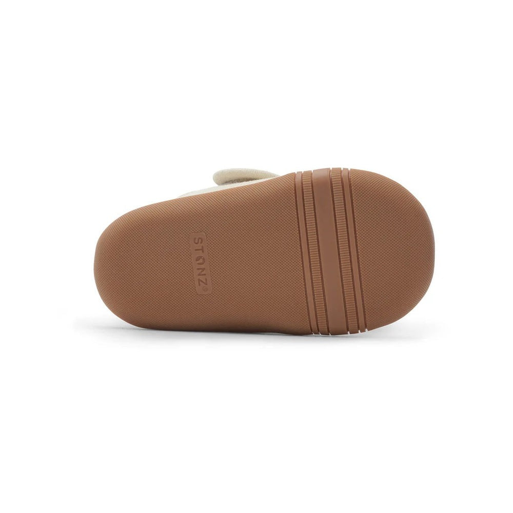 Stonz Cruiser Natural Baby Shoes Oatmeal — tan sole with textured grip tread shown in bottom view.