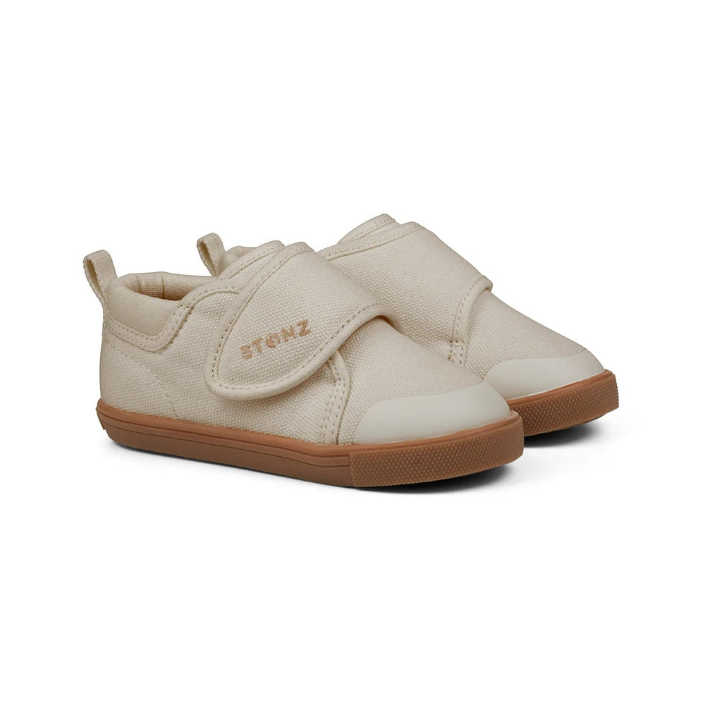 Stonz Cruiser Natural Toddler Shoes in oatmeal canvas with Velcro straps secured and tan rubber sole