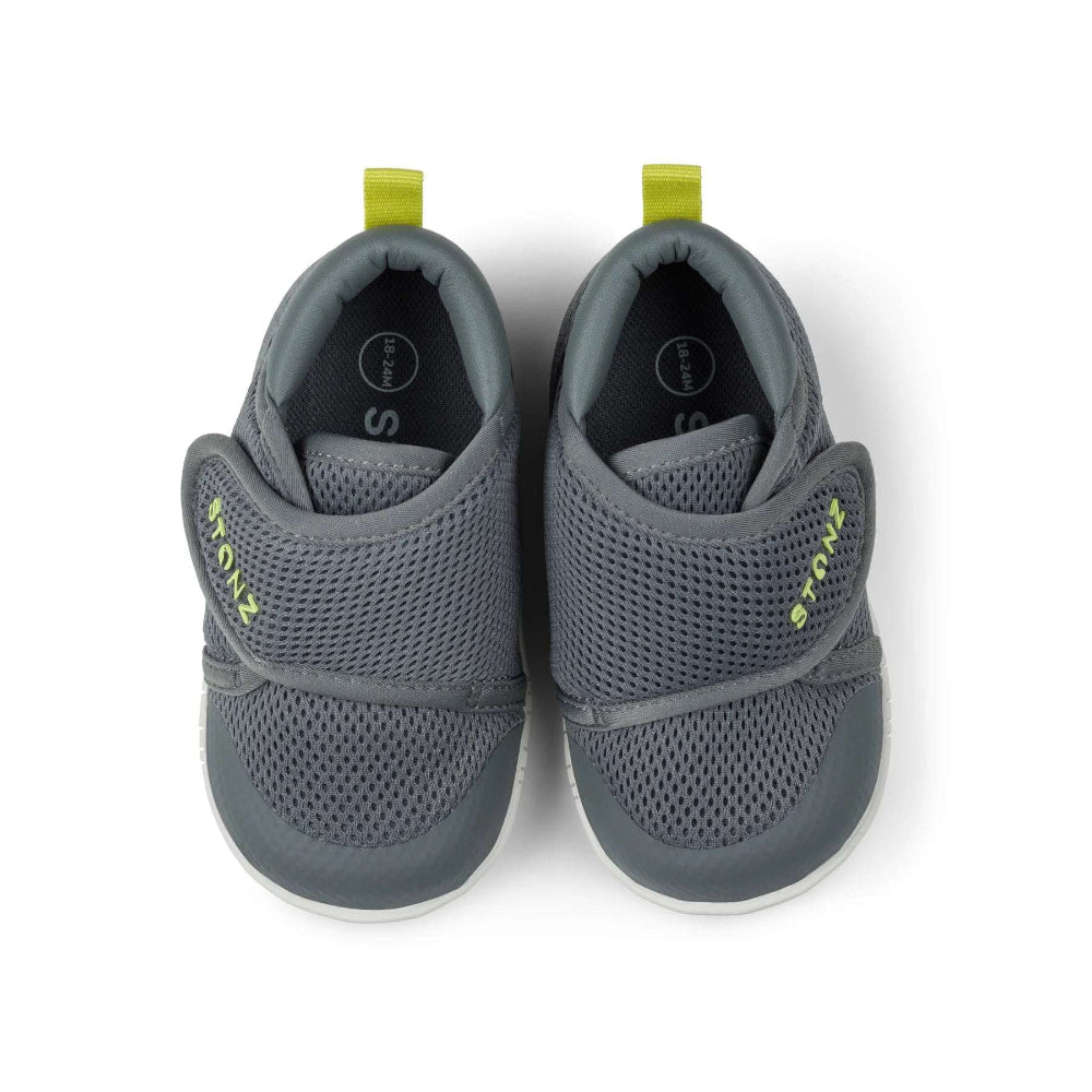 Stonz Cruiser Original baby shoes in steel gray with neon yellow pull tabs, pair