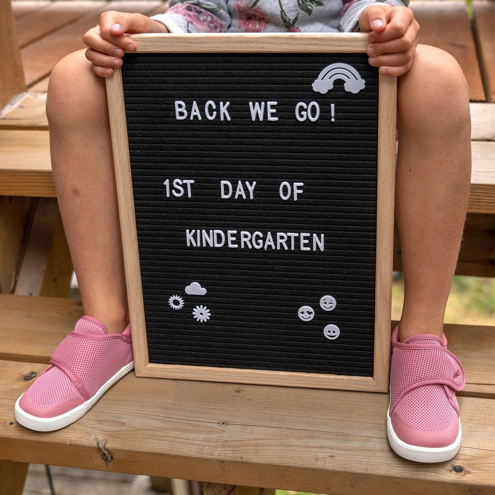 Stonz Cruiser Original Toddler Shoes Dusty Rose worn by a child on wooden steps, pink mesh sneakers.