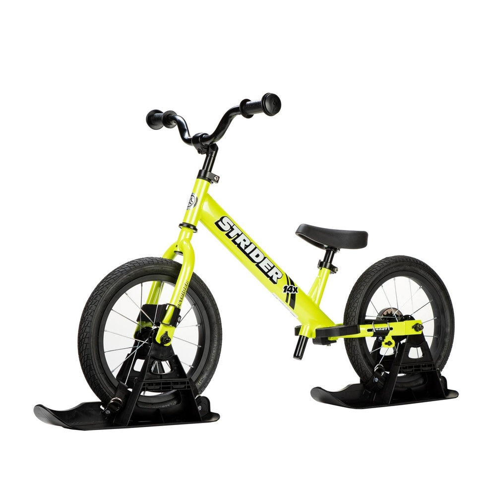 Strider 14X Sport Snow Skis set featuring bright yellow balance bike with black ski attachments