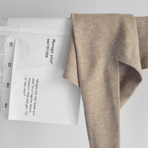 Tangentgc Sugar Cashmere Detergent 500 ml packaging with beige fabric.