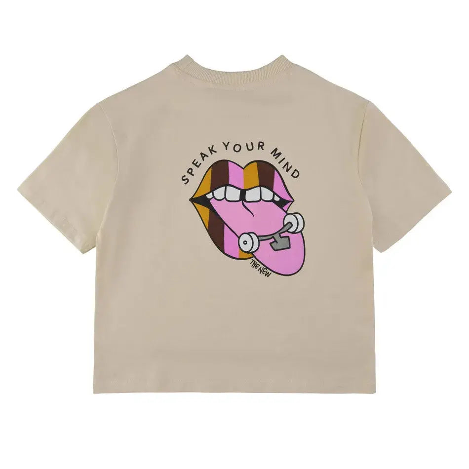 The New Halat-Shirt White Swan beige tee shown from back with a bold pink lips and stethoscope graphic.